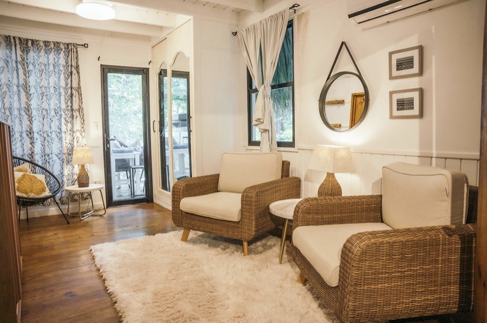 A bright, comfortable guest room at Boatique Hotel and Marina.